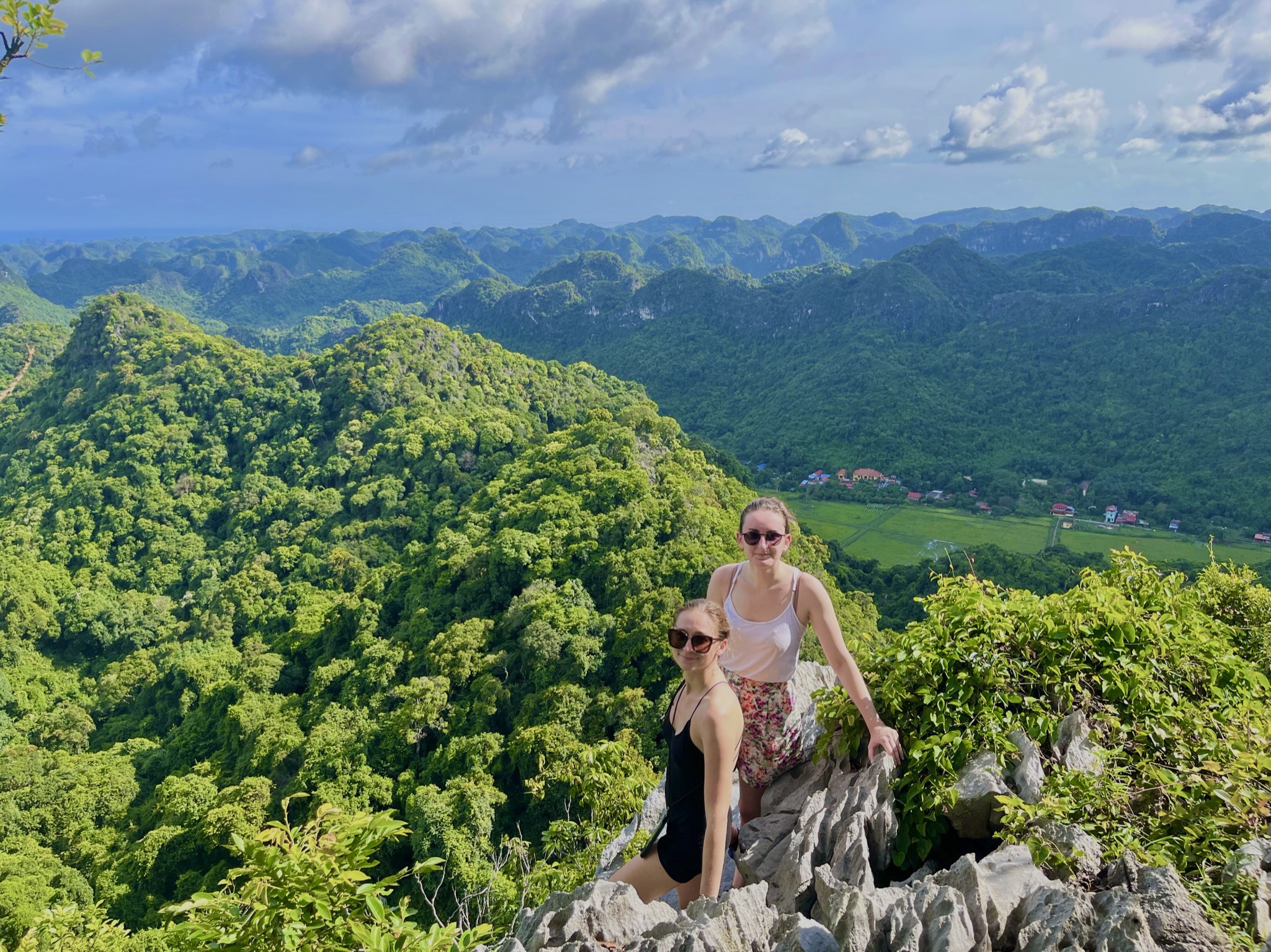 Green valley surrounded by jungle-covered limestone mountains in Cat Ba National Park