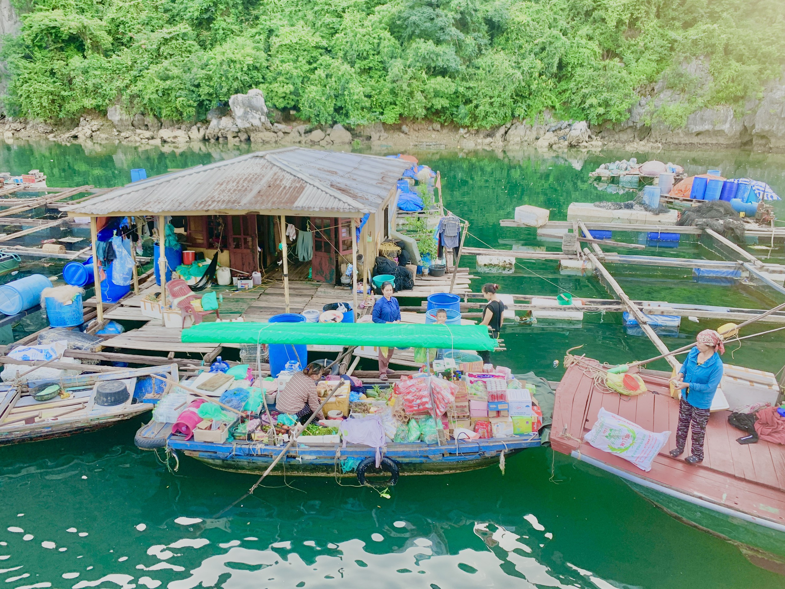 Floating fishing village with wooden houses on the water in Lan Ha Bay, Cat Ba