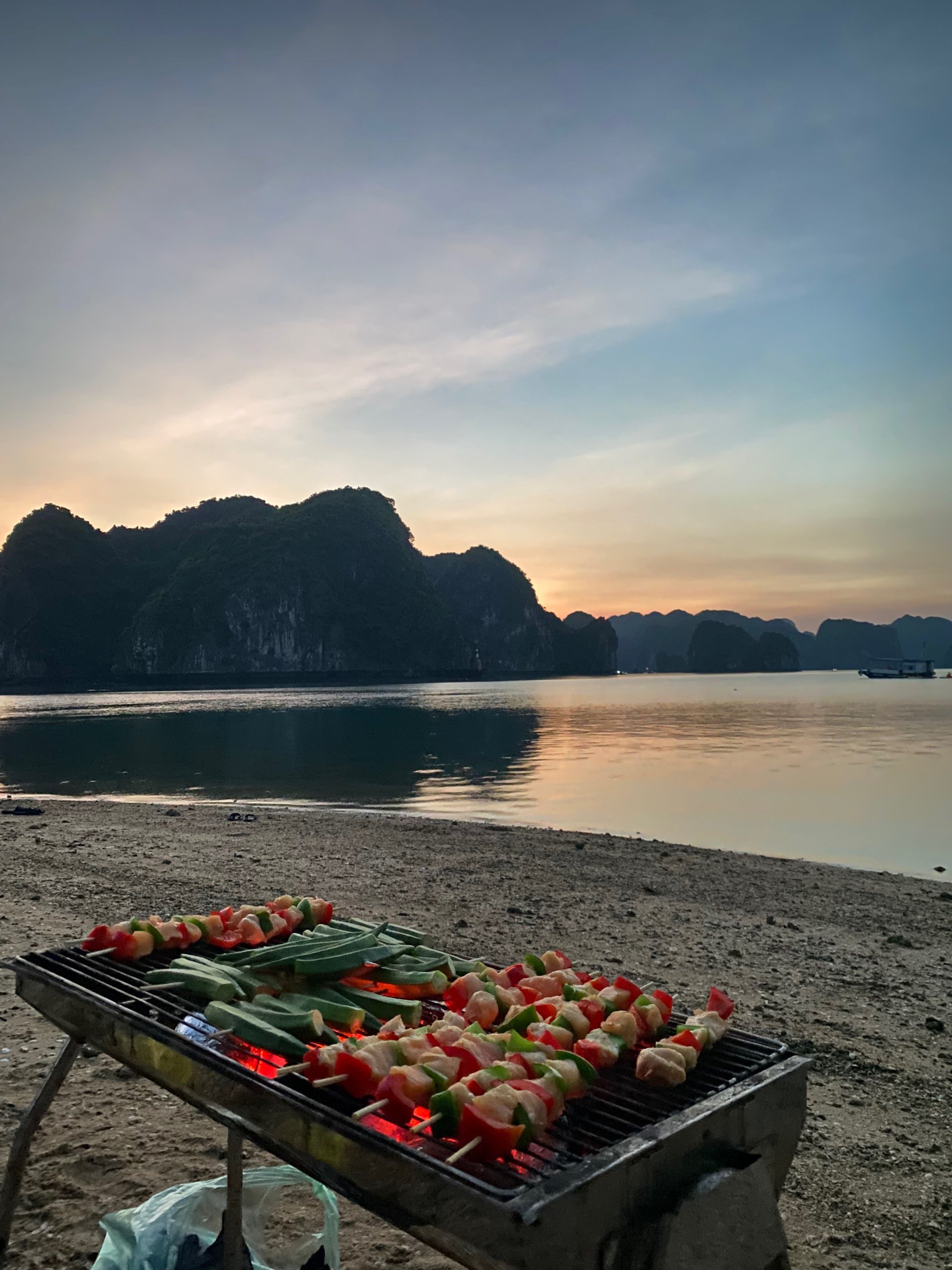 Sunset over the bay with limestone islands silhouetted, Cat Ba Island