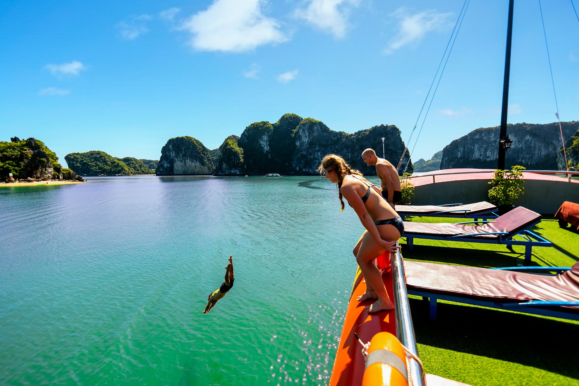 Kayaking through cave Lan Ha Bay