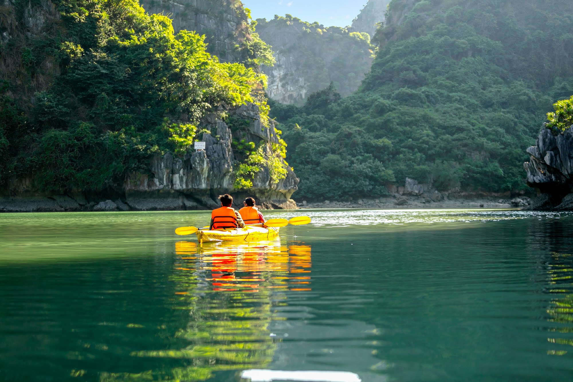 Swimming at secluded beach Lan Ha Bay