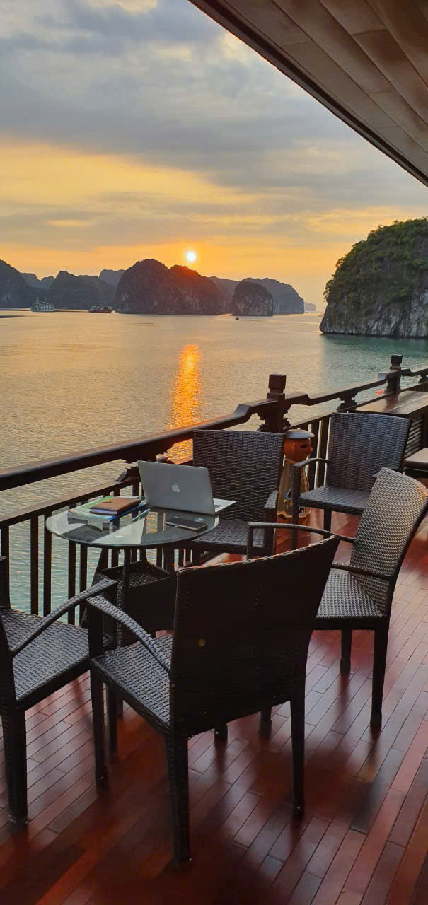 Traditional boat anchored in Lan Ha Bay cove overnight cruise
