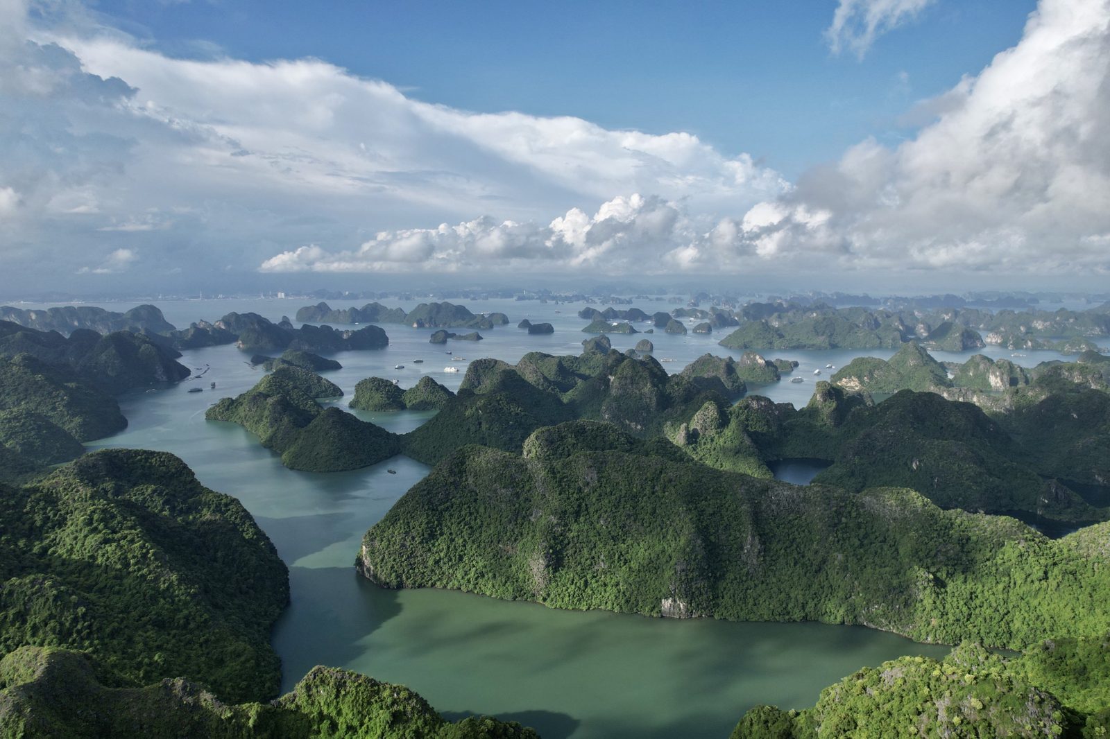 Aerial panorama of karst islands and green water in Lan Ha Bay