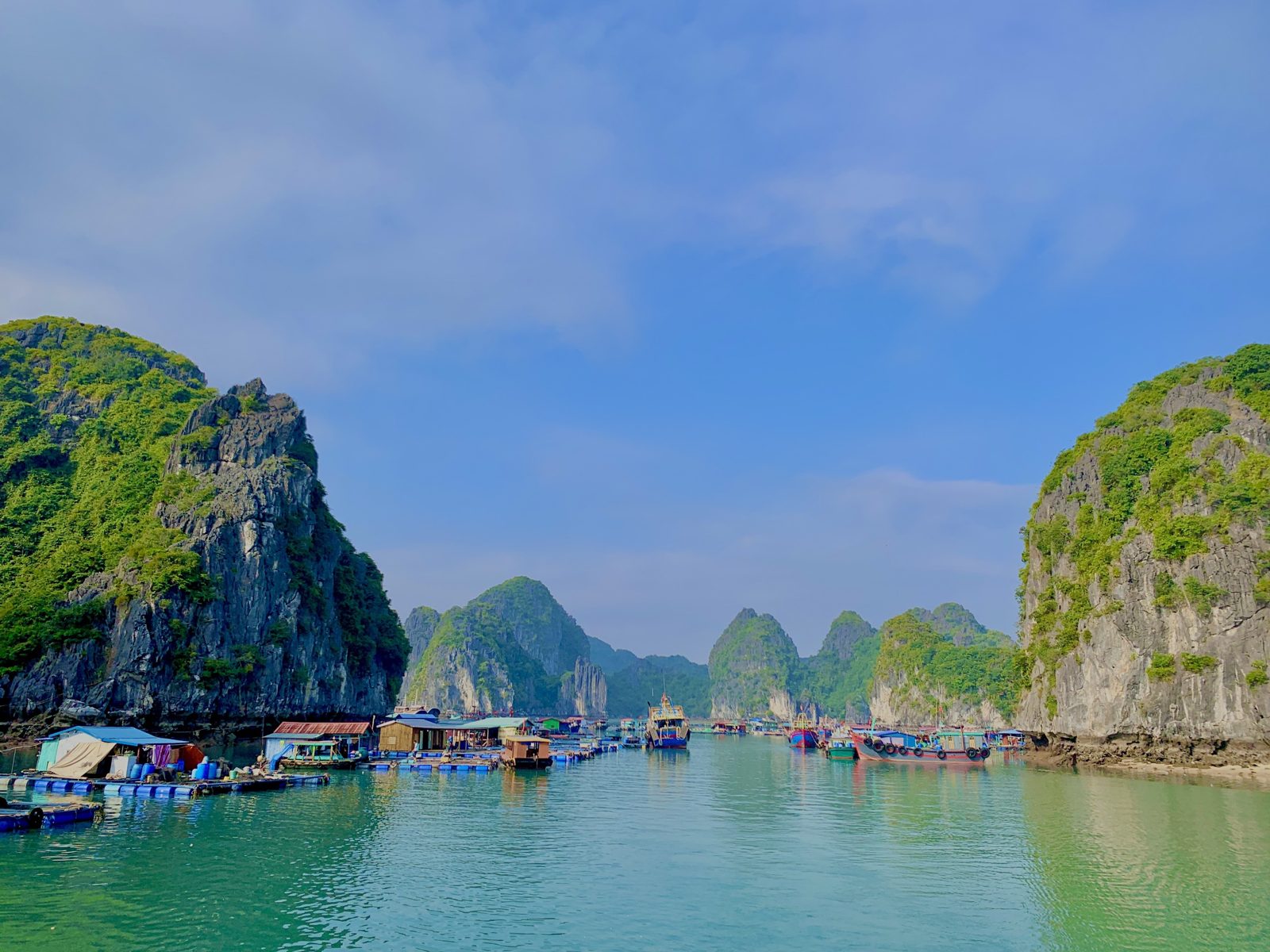 Cai Beo floating fishing village with houses on pontoons in Lan Ha Bay