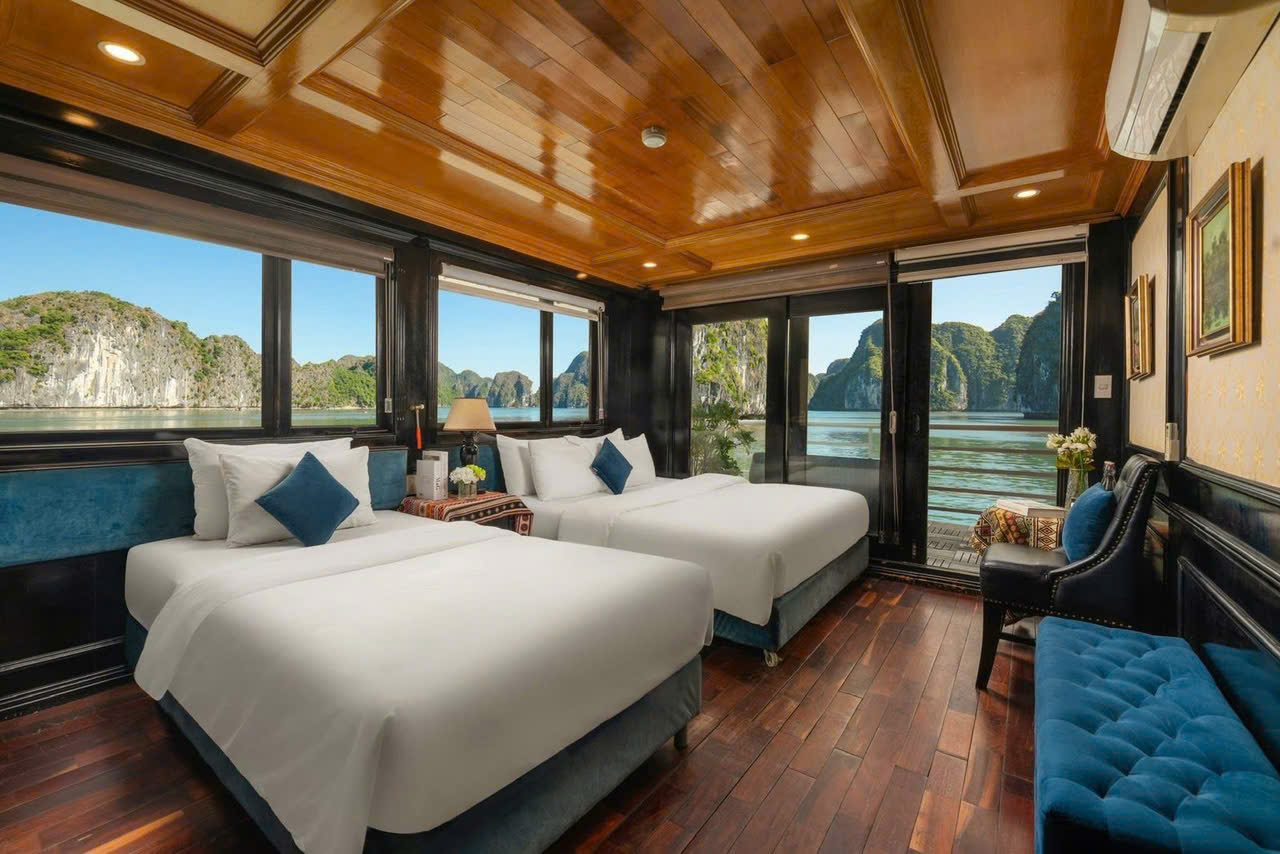 Twin beds in a cruise cabin with a bay window, Lan Ha Bay