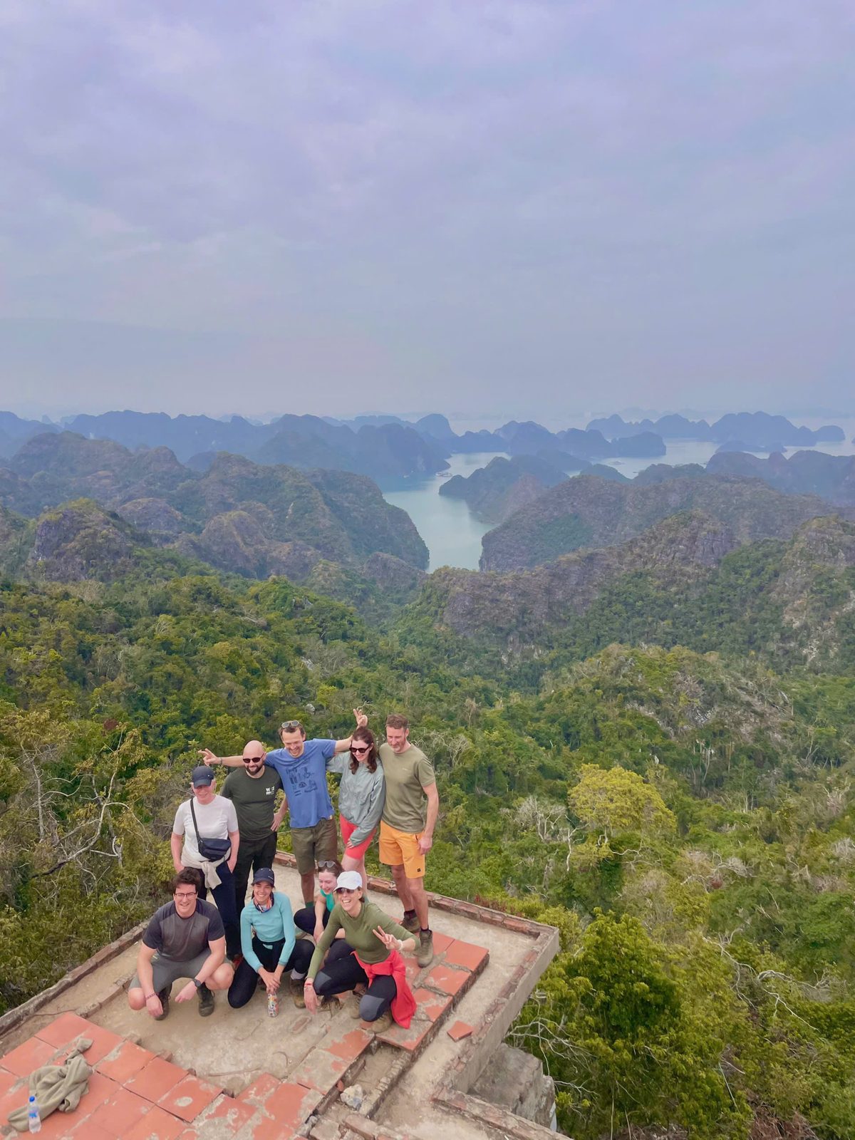 Group photo at a jungle viewpoint in Cat Ba National Park