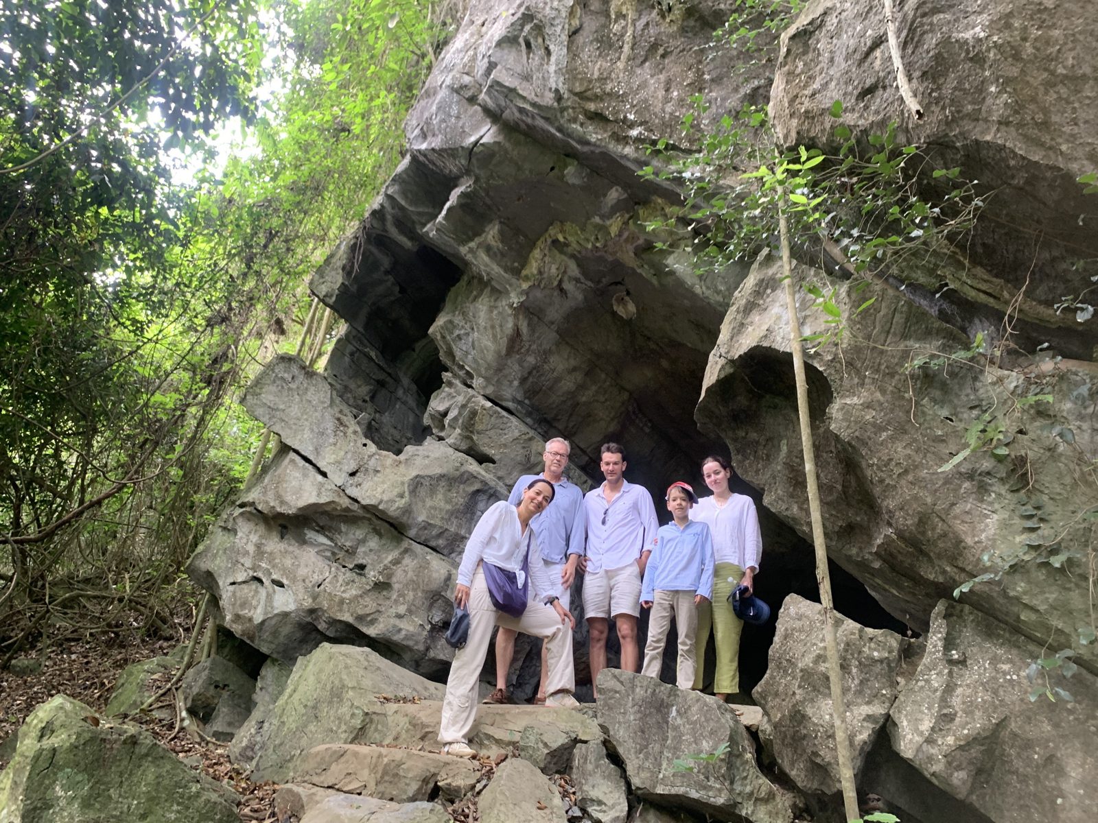 Hikers at a rock formation on the Cat Ba National Park trail
