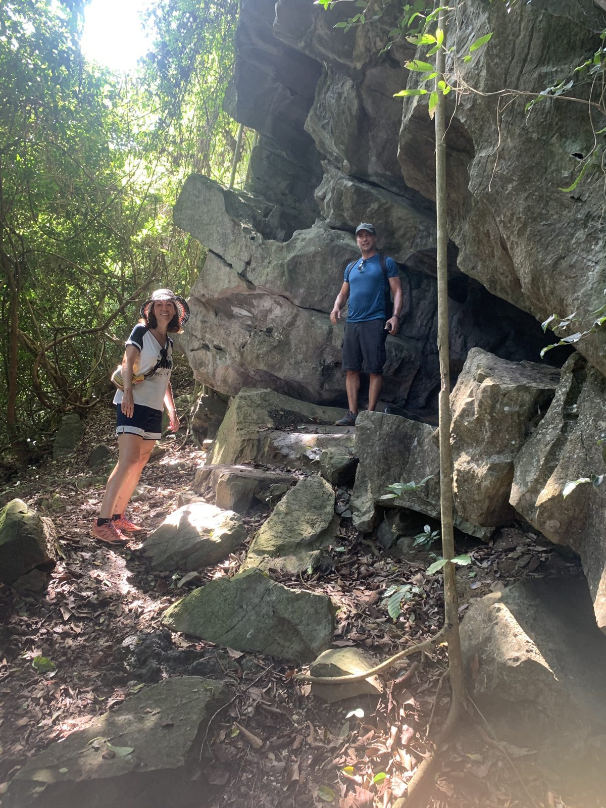 Hikers on a rocky jungle trail in Cat Ba National Park