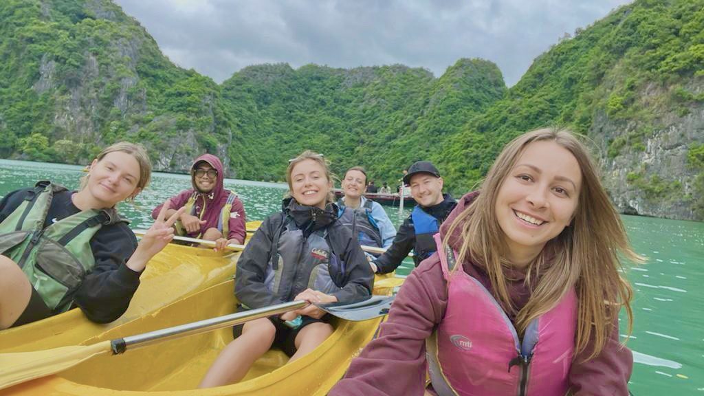 Group of kayakers taking a photo together on Lan Ha Bay